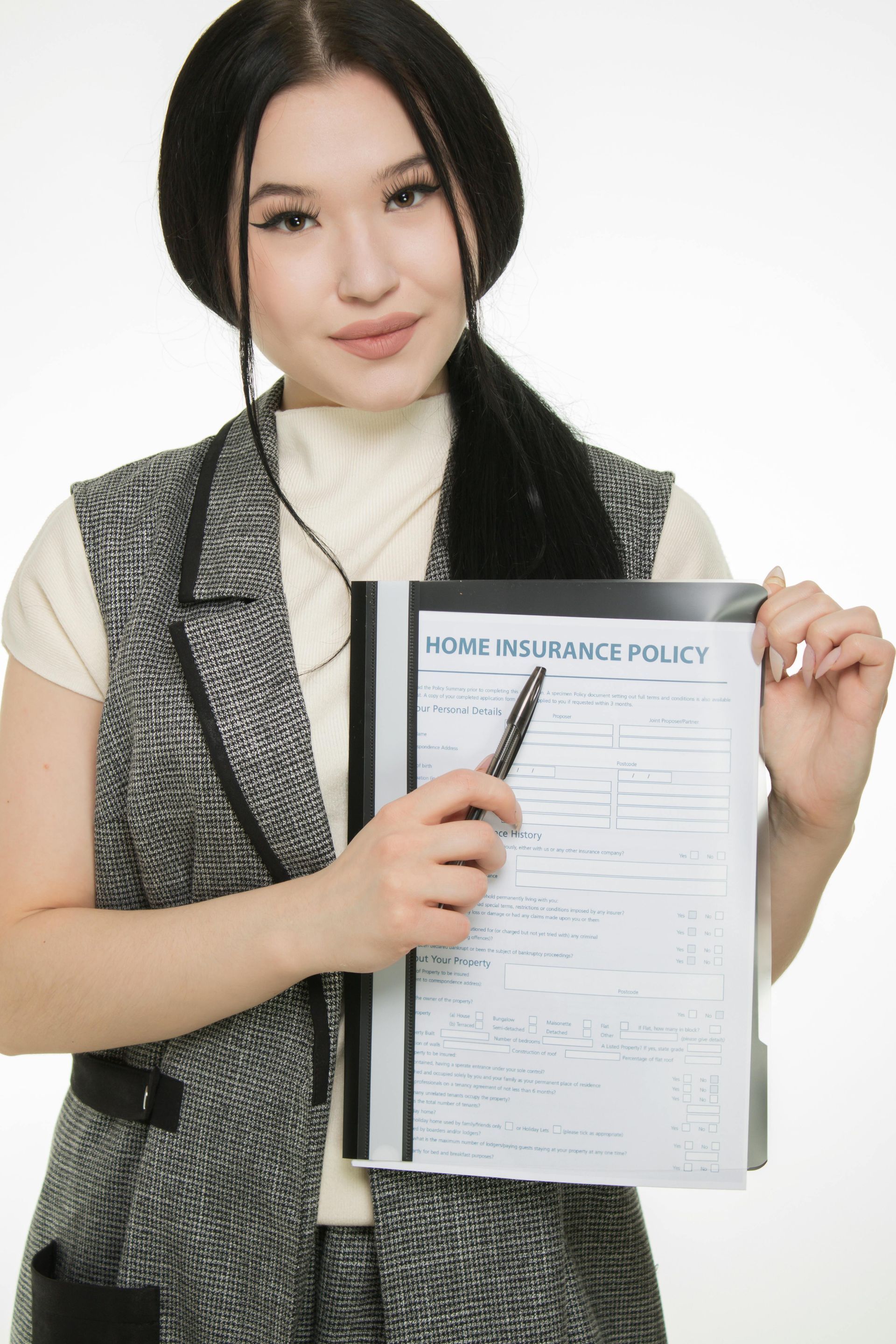 Woman in business attire points to a