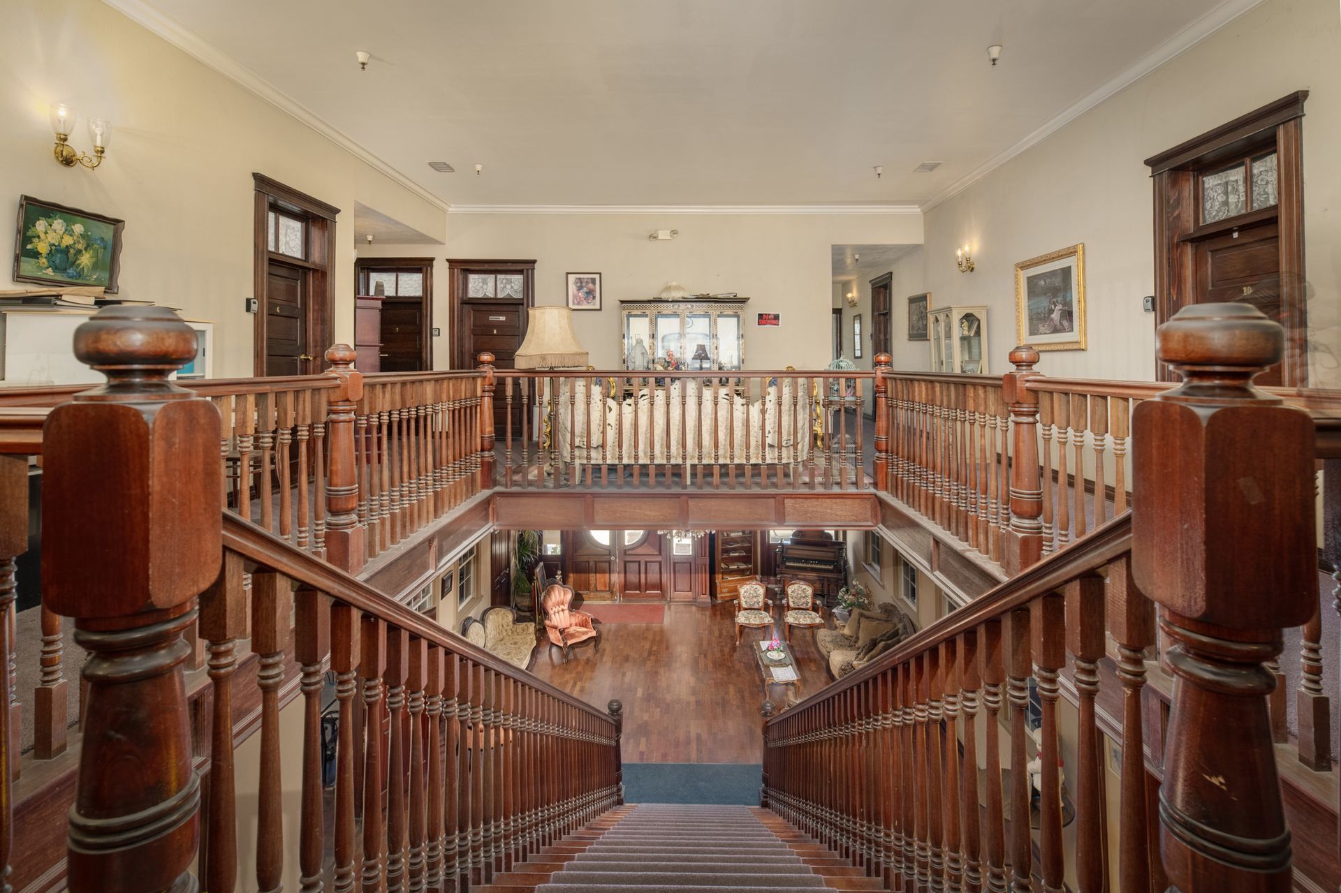 A wooden staircase leading up to the second floor of a building.