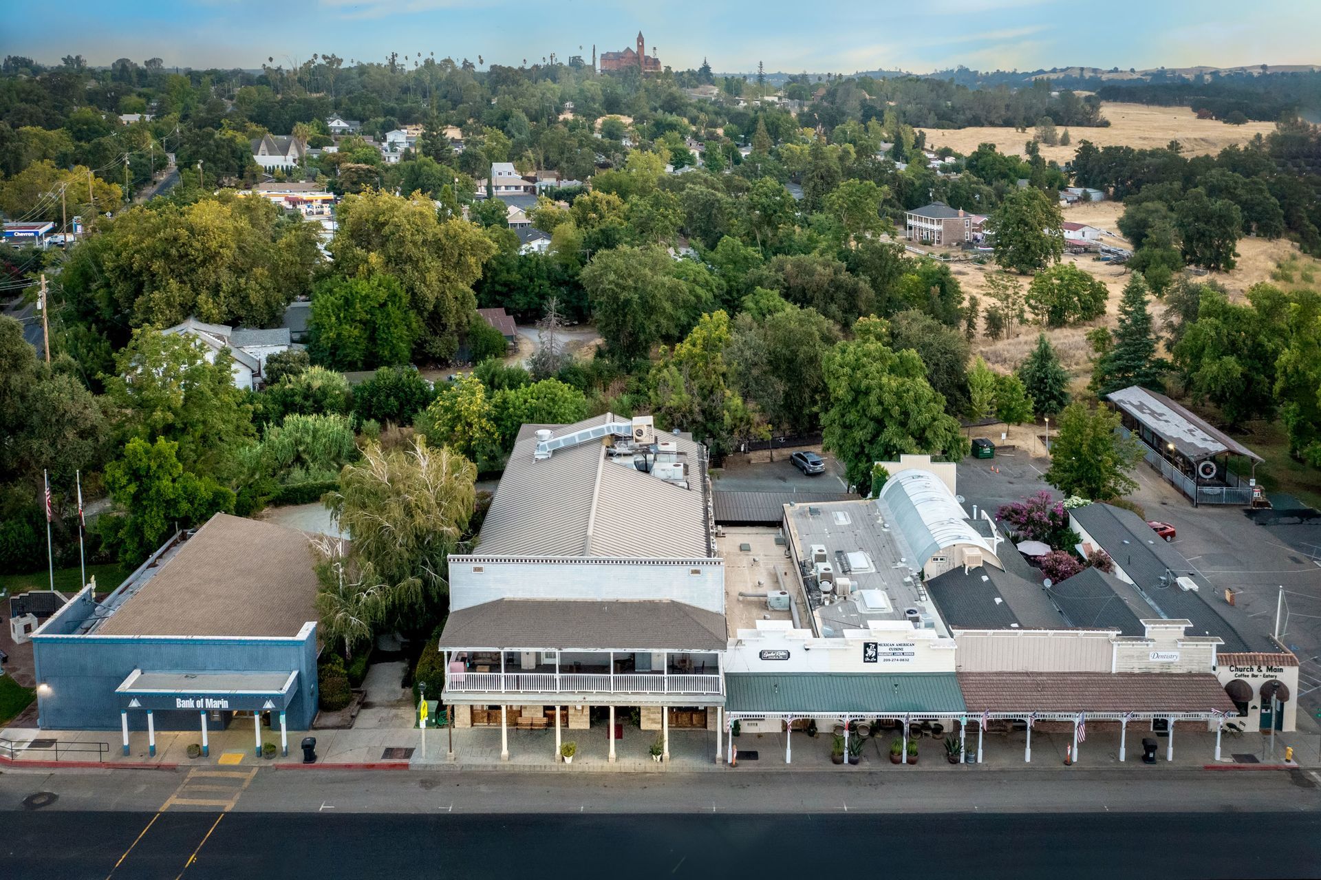 An aerial view of a small town with a lot of buildings and trees.