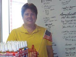 woman veteran showing american flag