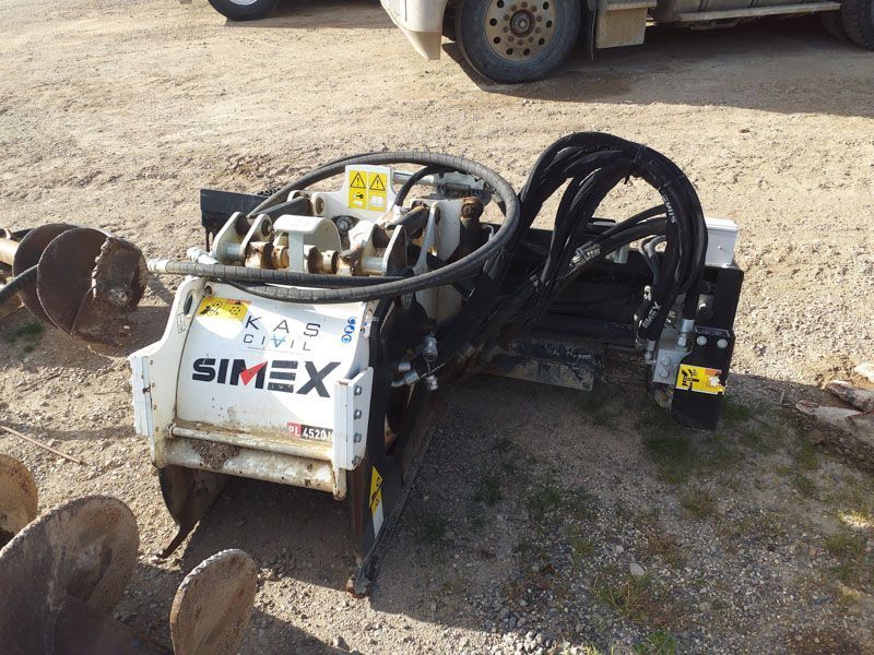 White Simex KA60 Civil auger attachment on a work site.