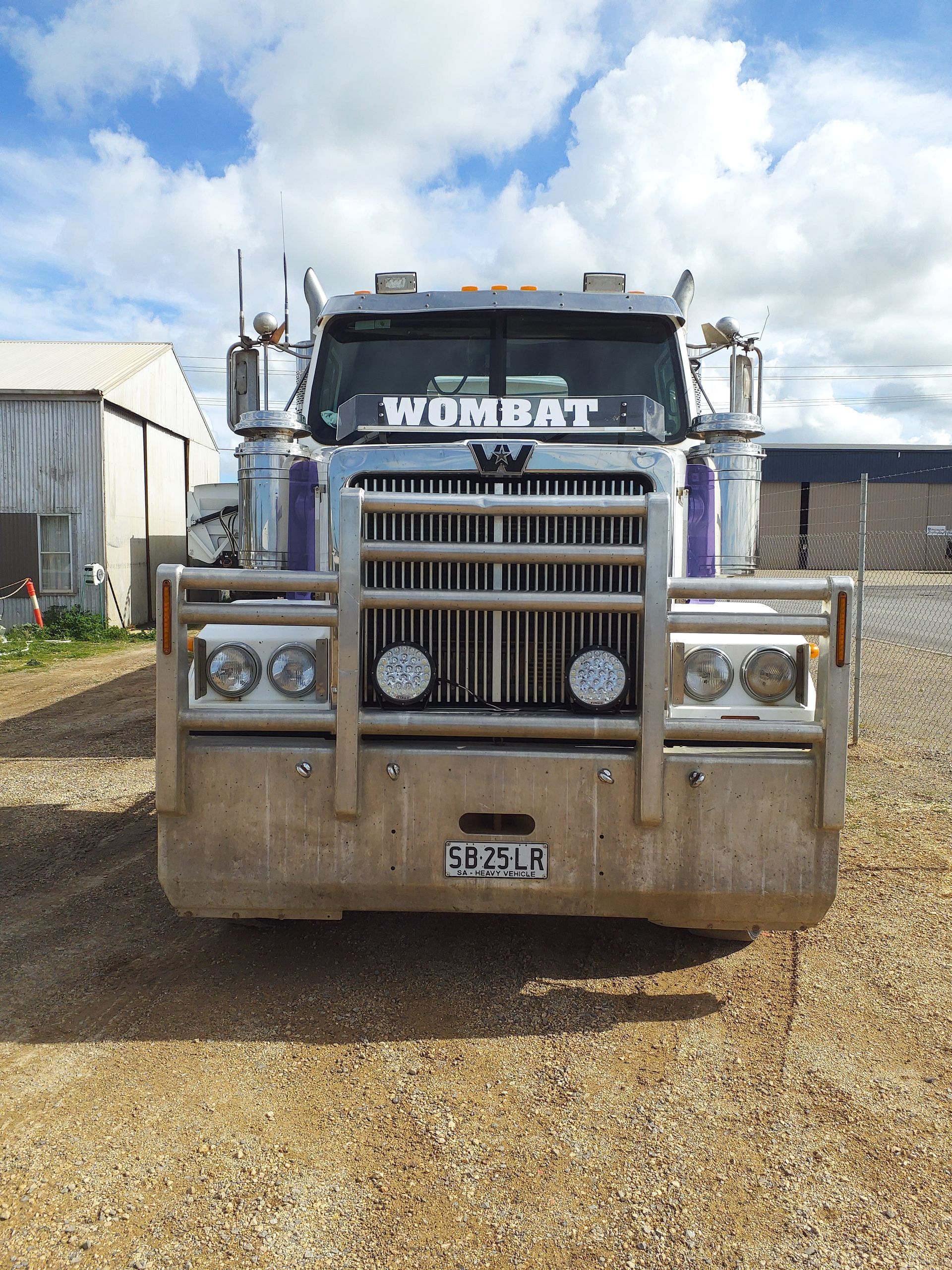 Front view of a silver semi-truck with 