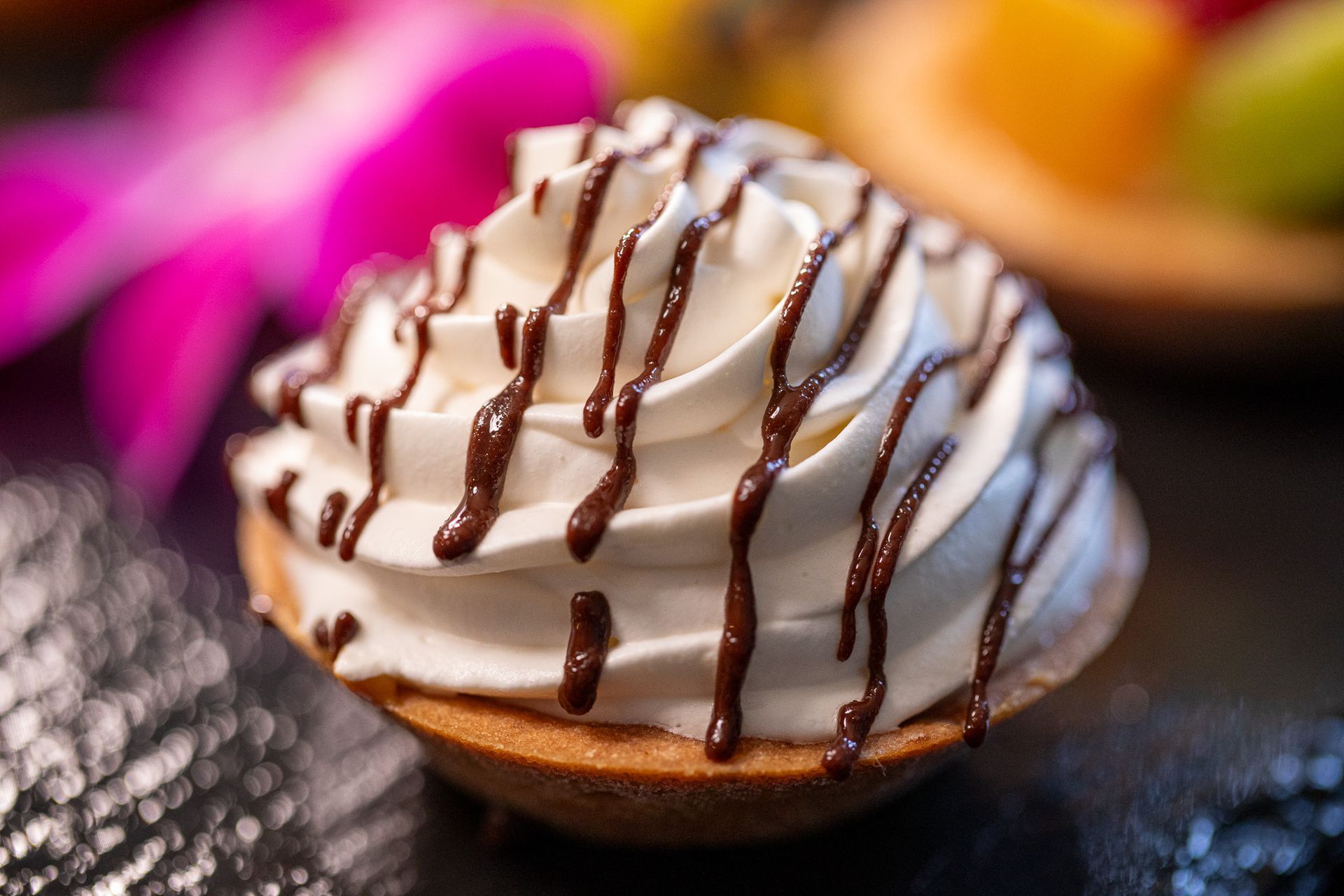 dessert with whipped cream and chocolate drizzle
