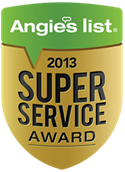 A gold shield-shaped badge with green top text reading 