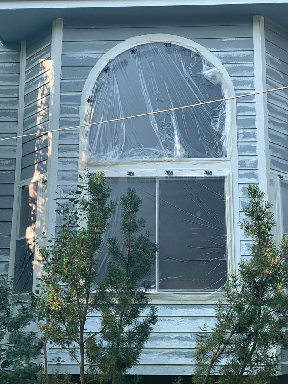 prep work for exterior painting, scrape sand and prime and masking