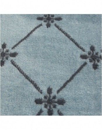 A close up of a blue rug with a black pattern on it.