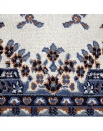 A close up of a rug with a floral pattern on it.