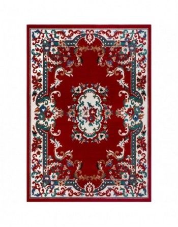 A red rug with a floral pattern on it