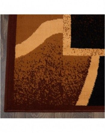 A brown and black rug with a geometric pattern