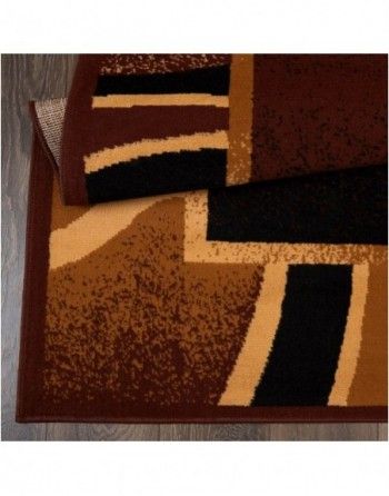 A brown and black rug with a geometric pattern