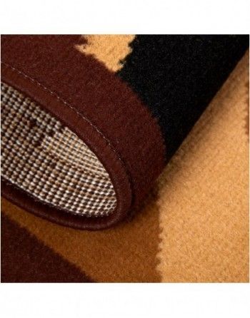 A close up of a brown and black rug
