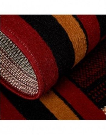 A close up of a red and black striped rug