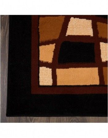 A black and brown rug with a square pattern on it