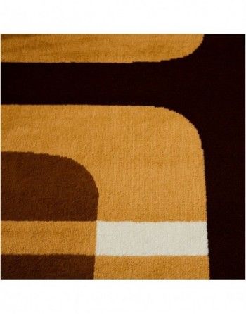 A brown and black rug with a white stripe on the bottom