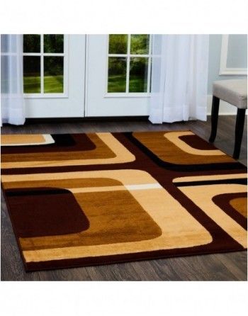 A brown and tan rug is on the floor in a living room