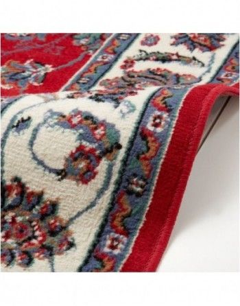 A close up of a red rug with a white border