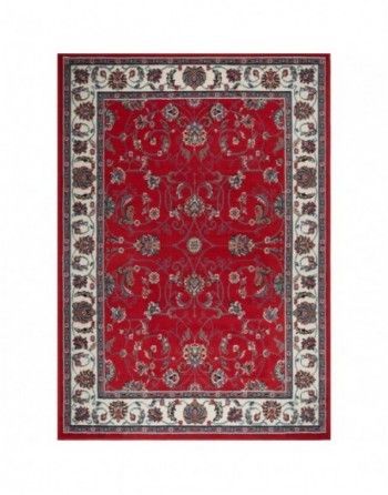 A red rug with a floral pattern on it