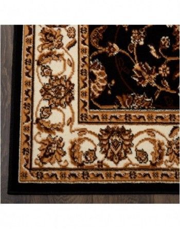 A black and white rug with a floral design on it