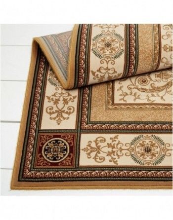 A rug with a floral pattern is rolled up on a table
