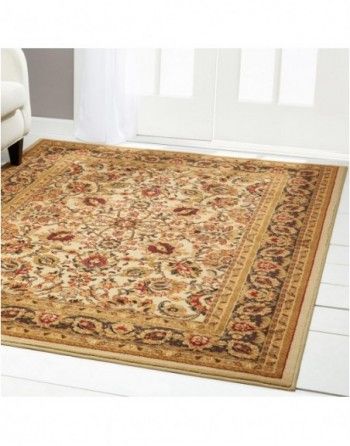 A rug is sitting on a white floor next to a chair