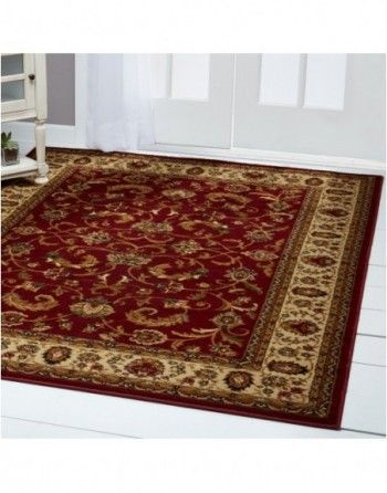 A red rug is sitting on a white floor in a room