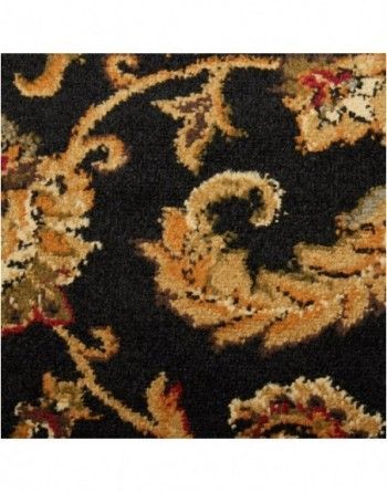 A close up of a black rug with a floral pattern