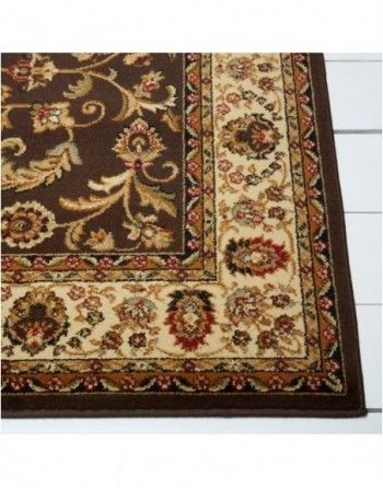 A brown rug with a floral pattern on it