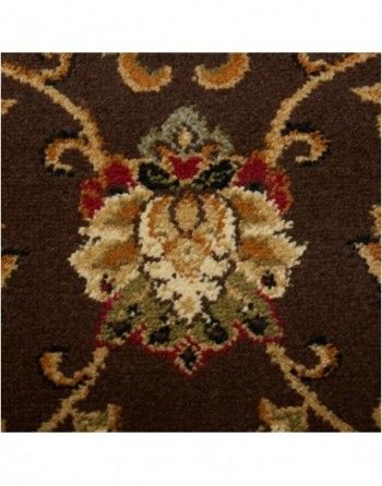 A brown rug with a floral pattern on it