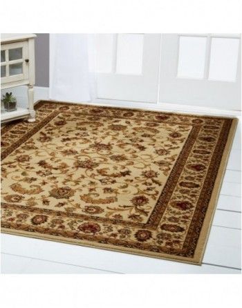 A rug is sitting on a white floor in a room.