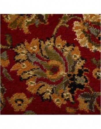 A close up of a red rug with a floral pattern