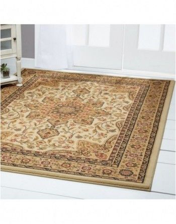 A rug is sitting on a white floor in a room.