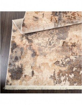 A rug is sitting on top of a wooden floor.