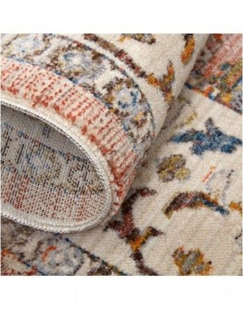 A close up of a rug with a floral pattern on it.