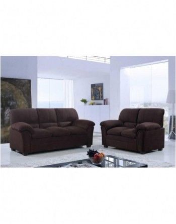 A living room with two brown couches and a glass coffee table.