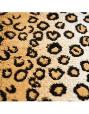 A close up of a leopard print rug with hearts on it