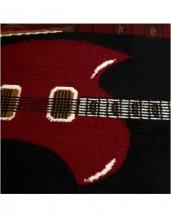 A close up of a red guitar on a black background