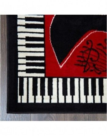 Black and white piano keys with a red heart in the middle
