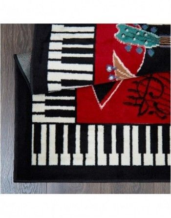 A rug with piano keys and a guitar on it