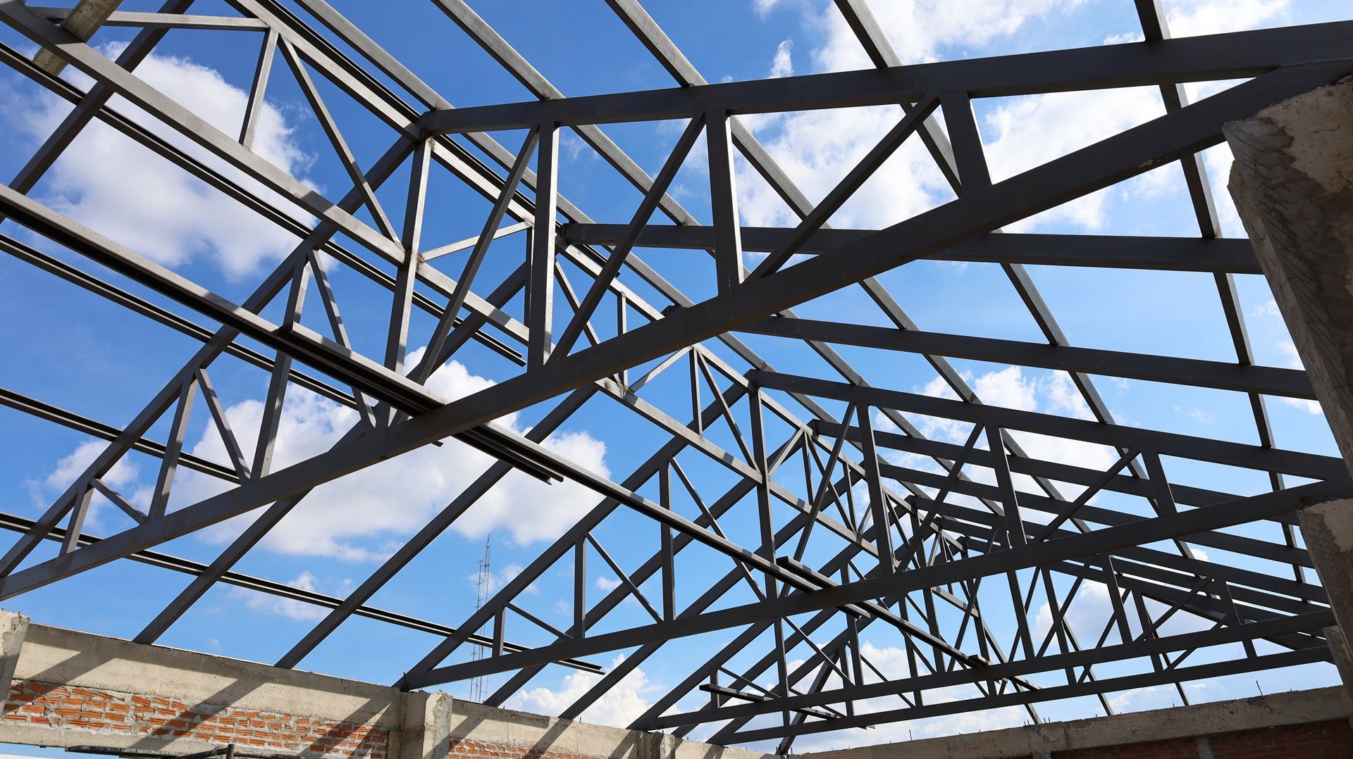 Looking up at the roof of a building under construction