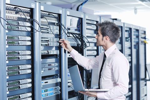 Professional IT Technician Checking on Servers