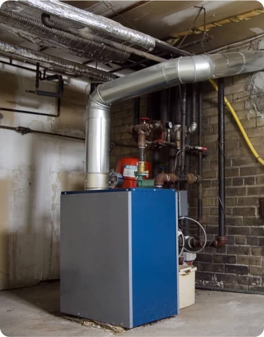 A rusty pipe is hanging from the ceiling in a room.