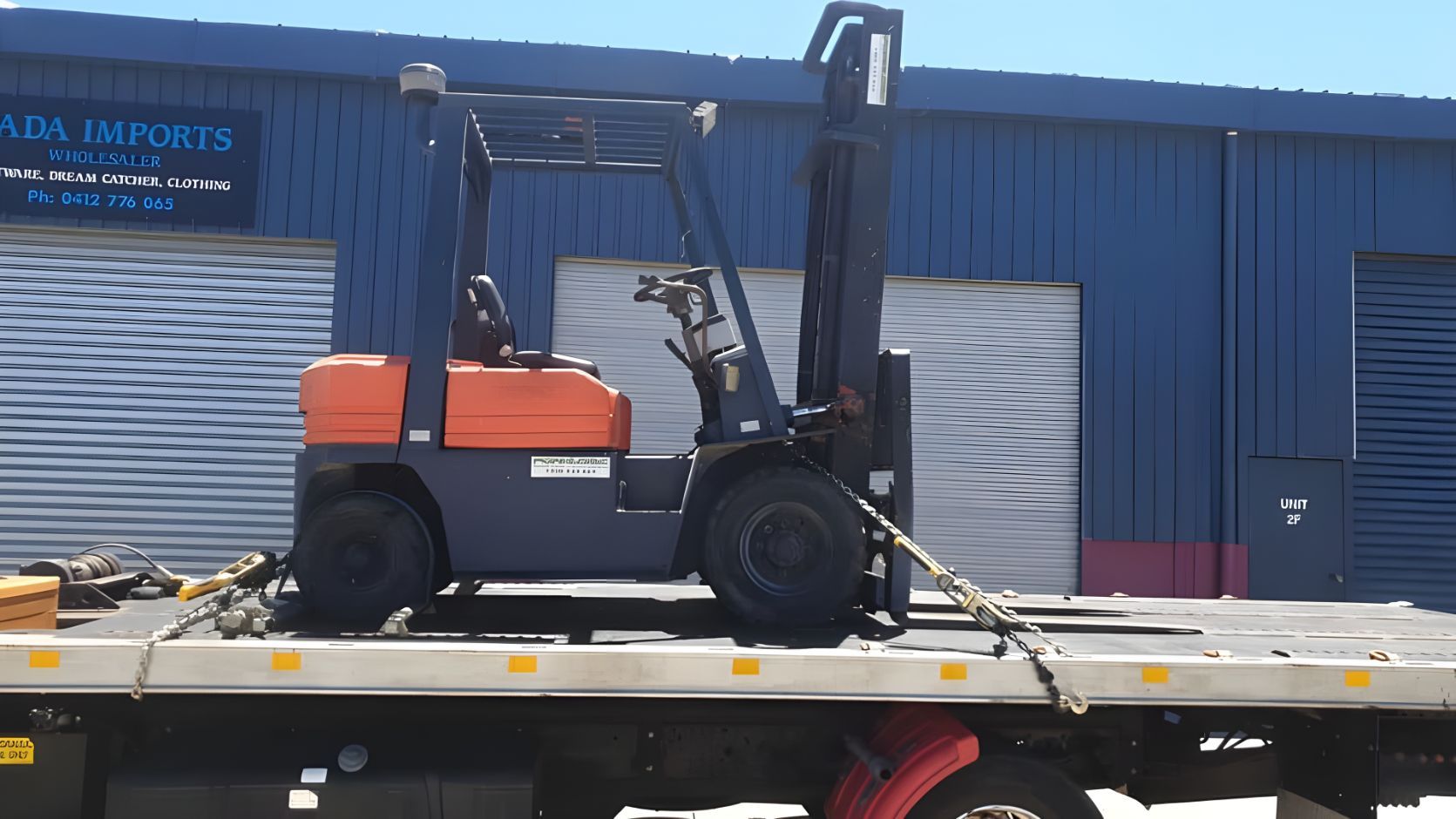 Forklift is on the Back of a Tow Truck — NCM Towing Newcastle In Kurri Kurri, NSW
