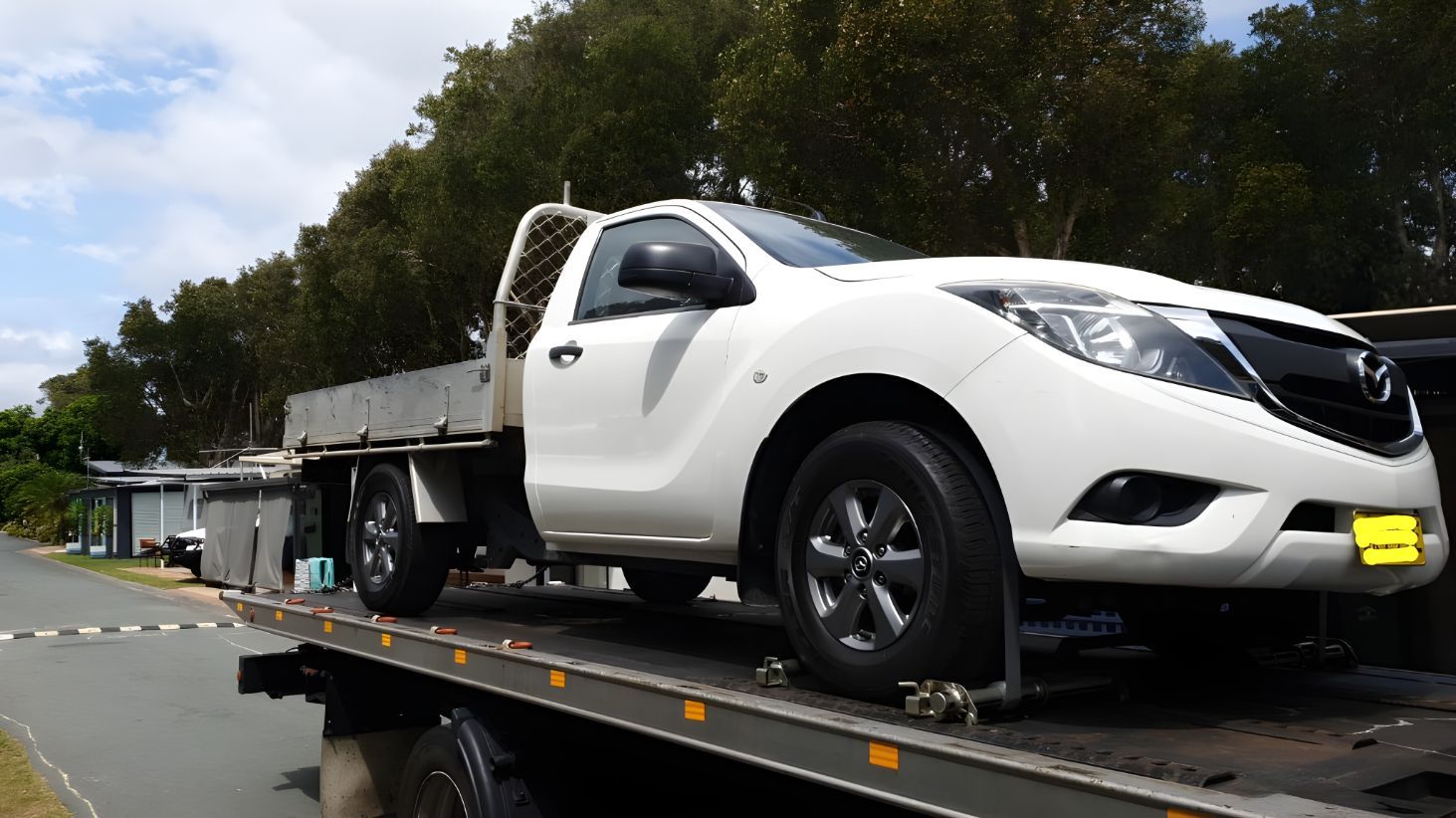 White Truck is Sitting on Top of a Tow Truck — NCM Towing Newcastle In Cessnock, NSW