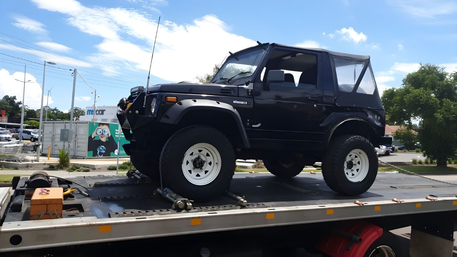 Black Jeep is Sitting on Top of a Tow Truck — NCM Towing Newcastle In Nelson Bay, NSW