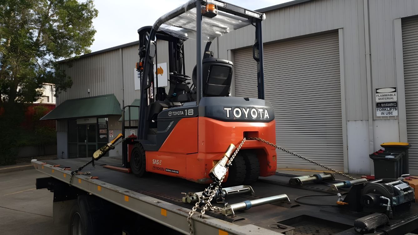 Toyota Forklift is Sitting on Top of a Tow Truck — NCM Towing Newcastle In Central Coast, NSW