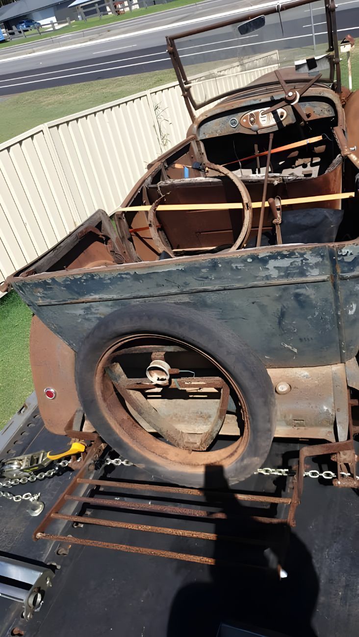 Old Car is Sitting on Top of a Trailer — NCM Towing Newcastle In Central Coast, NSW