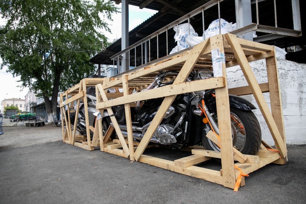 Motorcycle is Sitting in a Wooden Crate — NCM Towing Newcastle In Broadmeadow, NSW