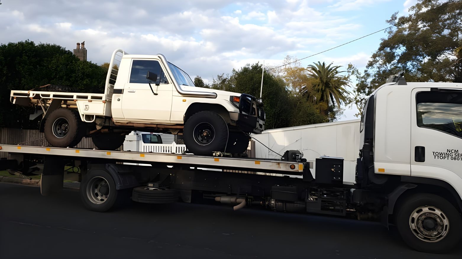 Tow Truck is Carrying a Truck on the Back of It — NCM Towing Newcastle In Port Stephens, NSW