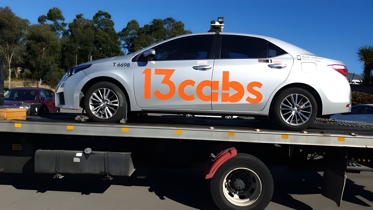 White Car With the Word 13cabs on the Side — NCM Towing Newcastle In Sydney, NSW