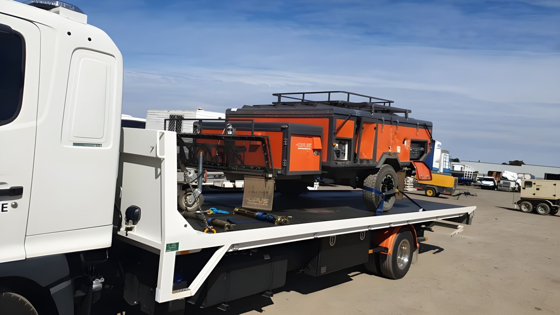 Tow Truck is Carrying a Trailer on the Back of It — NCM Towing Newcastle In Broadmeadow, NSW